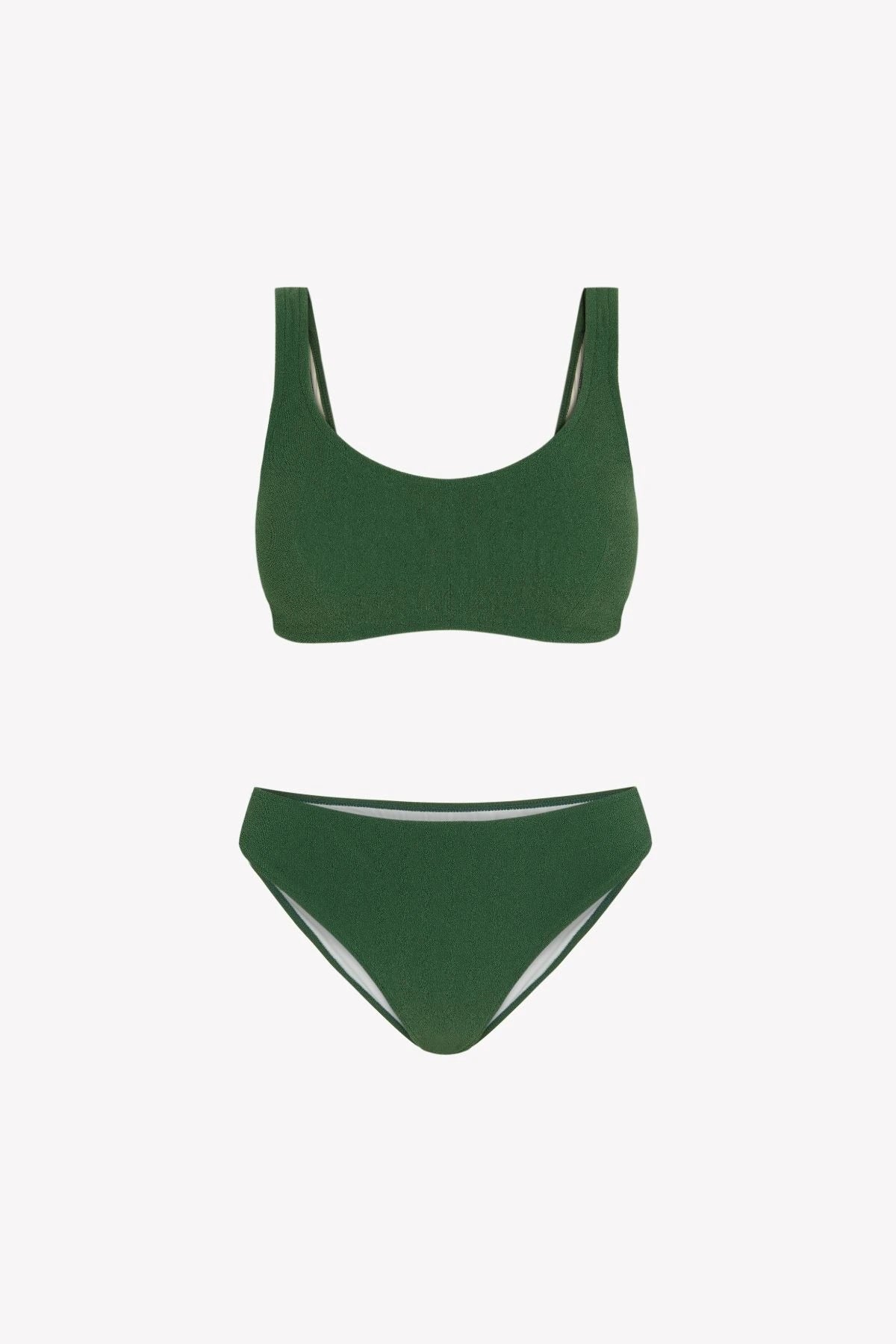 Bikini sostenible Mani Bimba Palm de CIRCU. Top deportivo con tiras anchas y opción de copas, y braga de cobertura normal. Tejido reciclado 100% ECONYL® en verde oscuro mediterráneo con textura atoallada. Hecho artesanalmente en España.