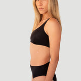 Bikini sostenible Mani Bimba Moon High negro vista lateral con top deportivo y braga alta - CIRCU